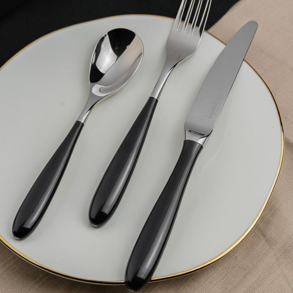 24 Piece Cutlery Set for 6 People Yin & Yang Black 24BX650BK-IGLC Grunwerg Modern Stainless steel cutlery set on a plate
