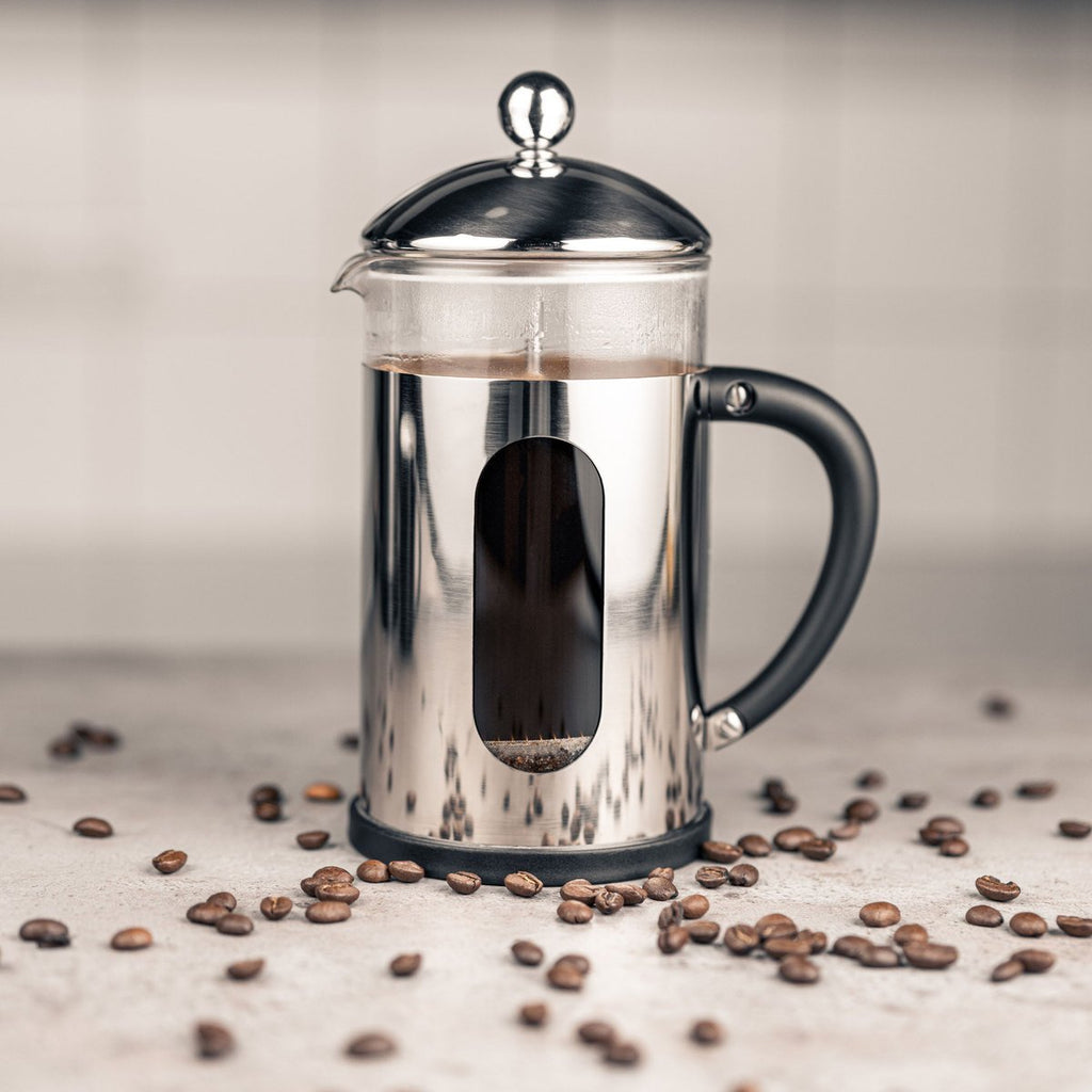 3 Cup Desire Cafetiere, Stainless Steel Cafe Olé BVM-03S Grunwerg Coffee Press surrounded by coffee beans brewing coffee