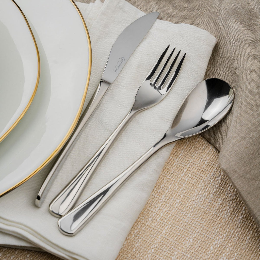44 Piece Cutlery Set for 6 People Fiesta 44BXFTA-IGLC Formal Grunwerg Stainless steel cutlery set on a napkin dining setting