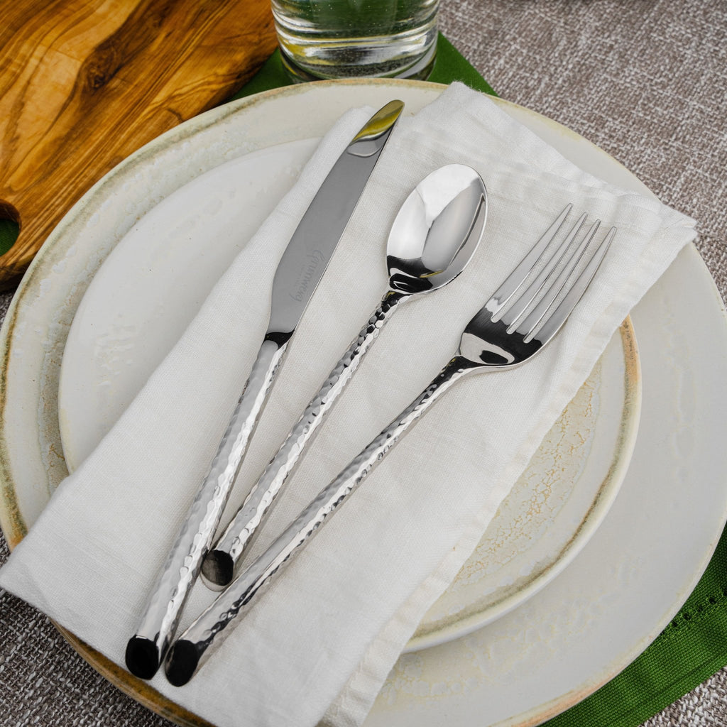 84 Piece Cutlery Set for 12 People Tango  Grunwerg Contemporary Cutlery set on a napkin and plate on a dining table